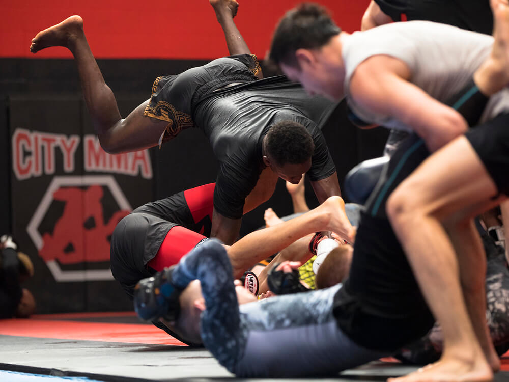 Adesanya training with fellow fighters at City Kickboxing. Photo: Clinton Tudor